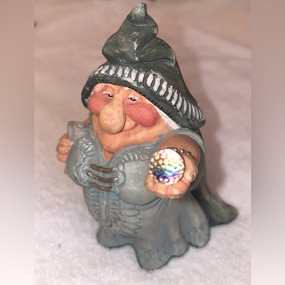 Krystonia Woman holding Glass Ball